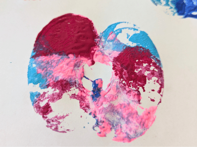 Apple stamp example with red, blue, and pink colors.