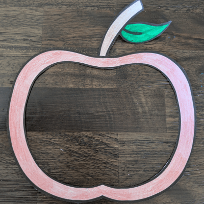 Apple template after being cut out and colored in.