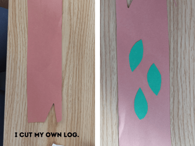 Example of log and leaves cut out of construction paper for the caterpillar paper plate craft.