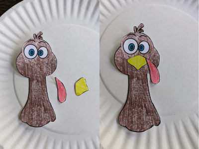 Turkey printable template colored in and on top of a white paper plate.