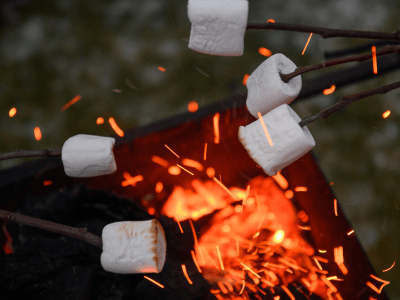 Marshmallows roasting over a fire.