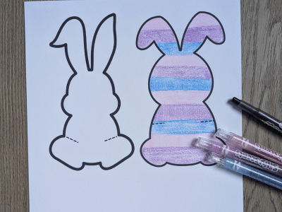 Two bunny templates on white paper. One template is colored in a striped pattern or pink, purple, and blue.