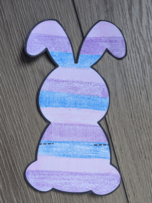 Pink, purple, and blue striped paper bunny.